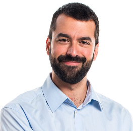 A dark-haired man with a full beard, smiling at the camera with his lips closed.